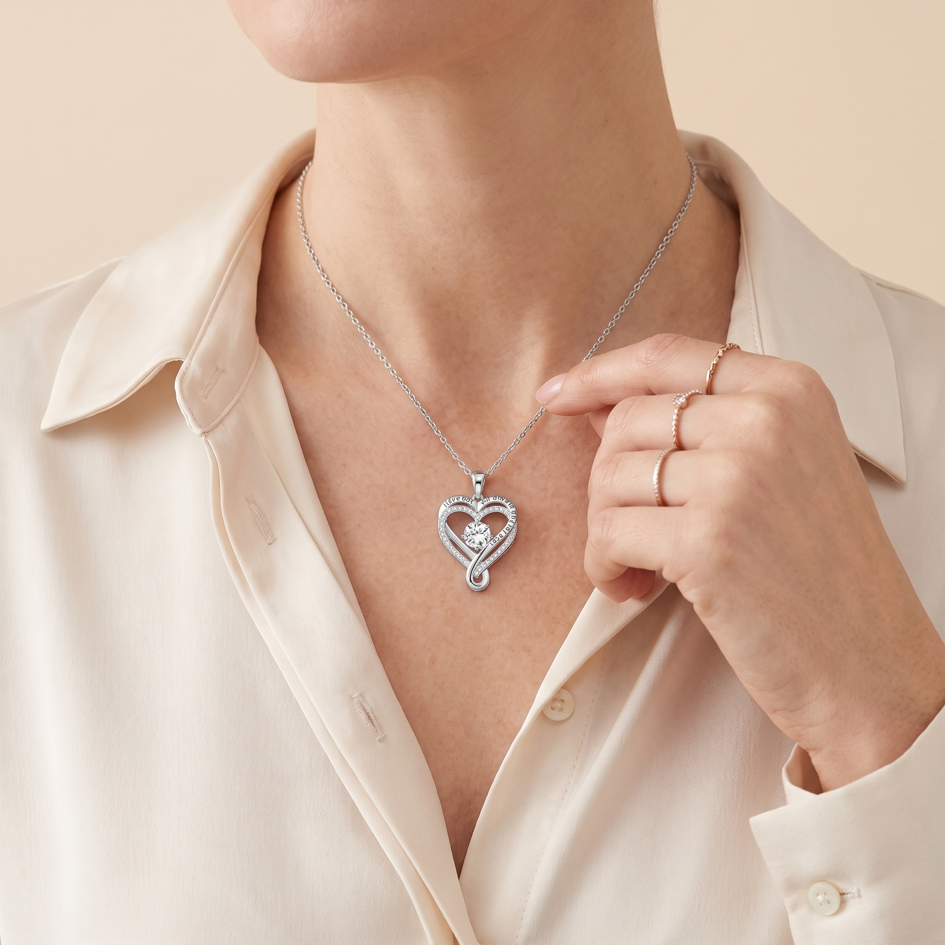Engraved heart necklace worn