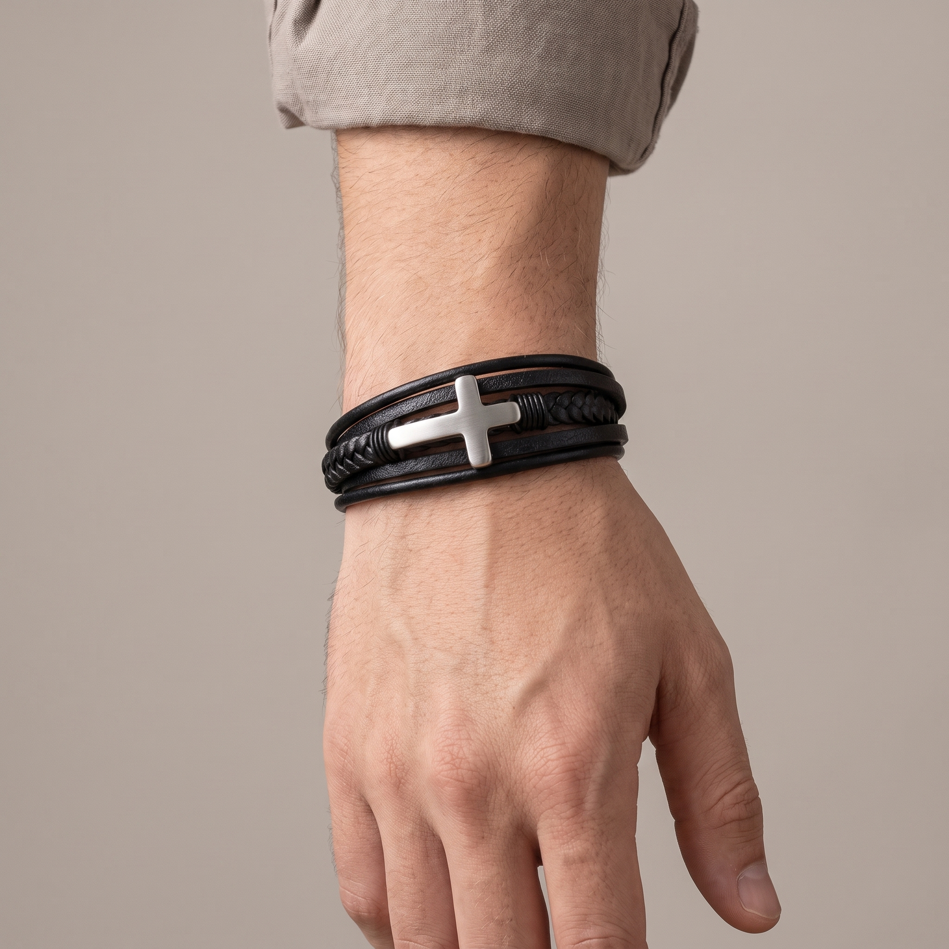 Grandson's cross bracelet worn on wrist