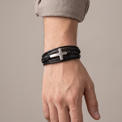 Grandson's cross bracelet worn on wrist