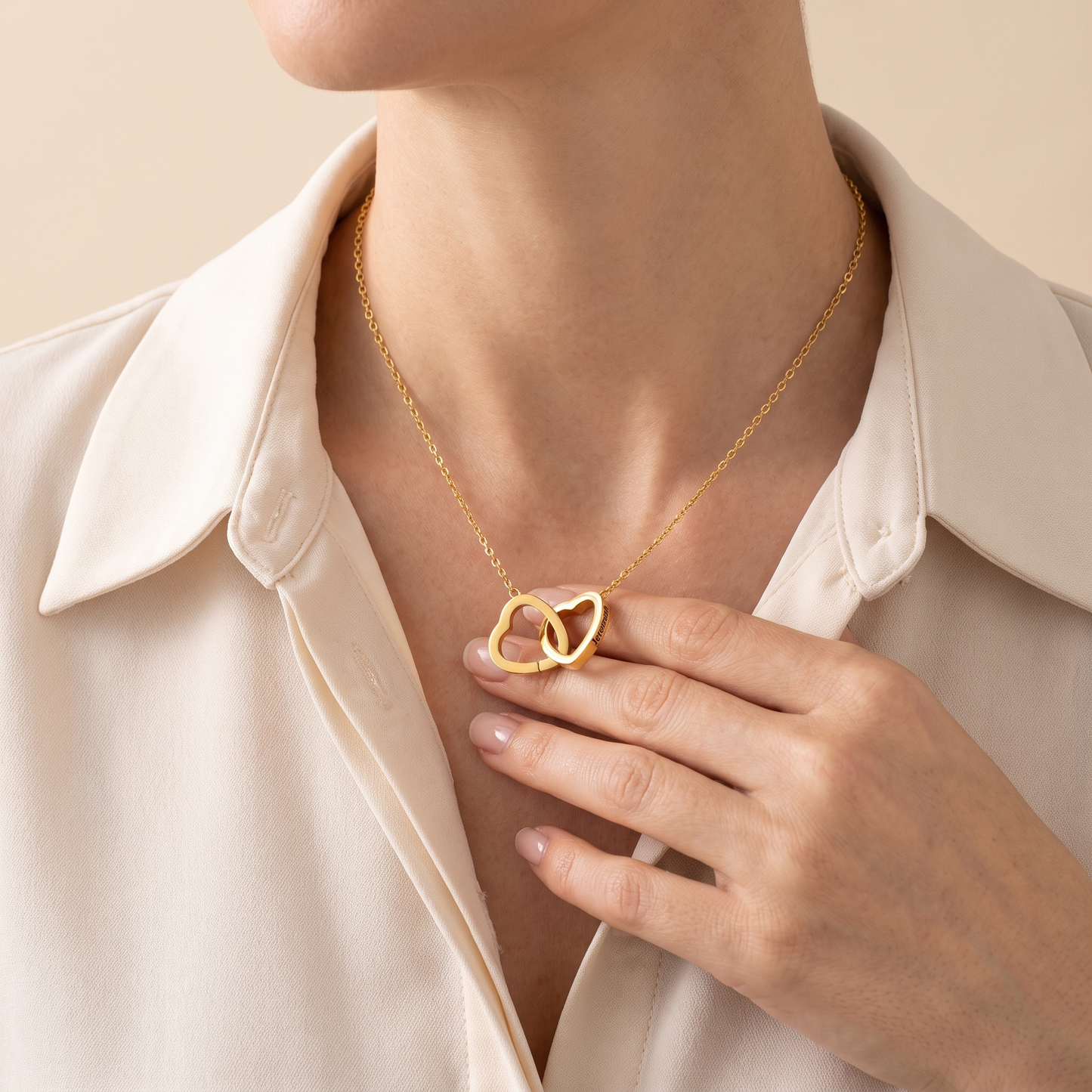 Interlocking hearts necklace worn
